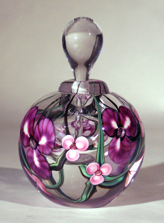 pink and purple flowers on clear glass keepsake urn