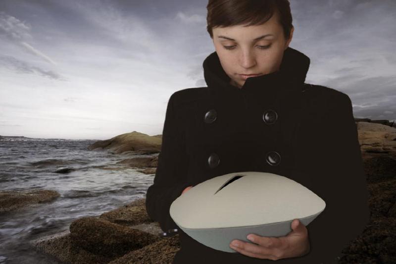 Girl holding sea urn
