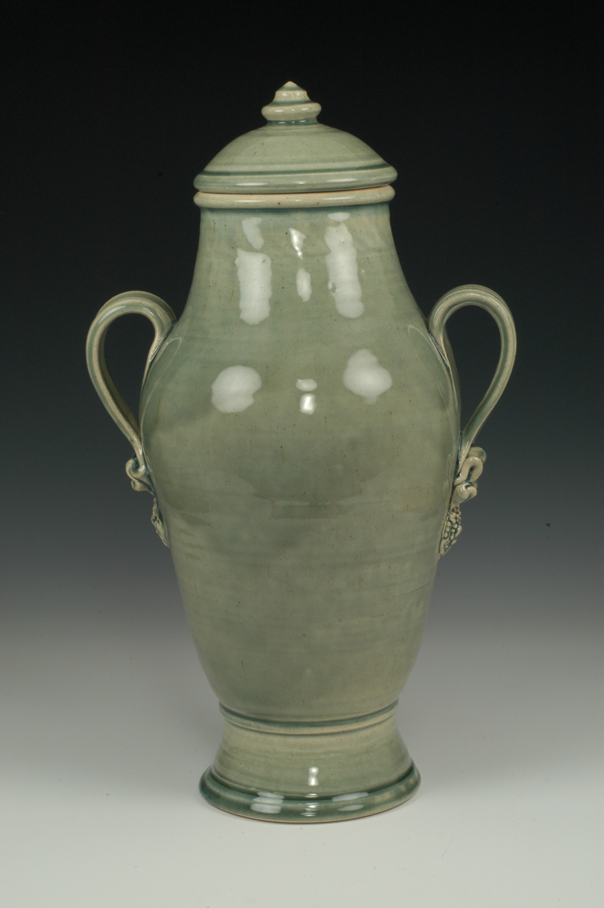 Sage green ceramic urn