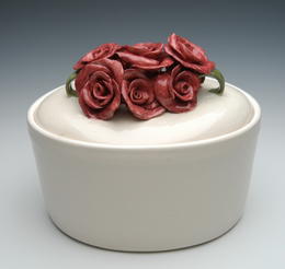 White urn with ceramic roses