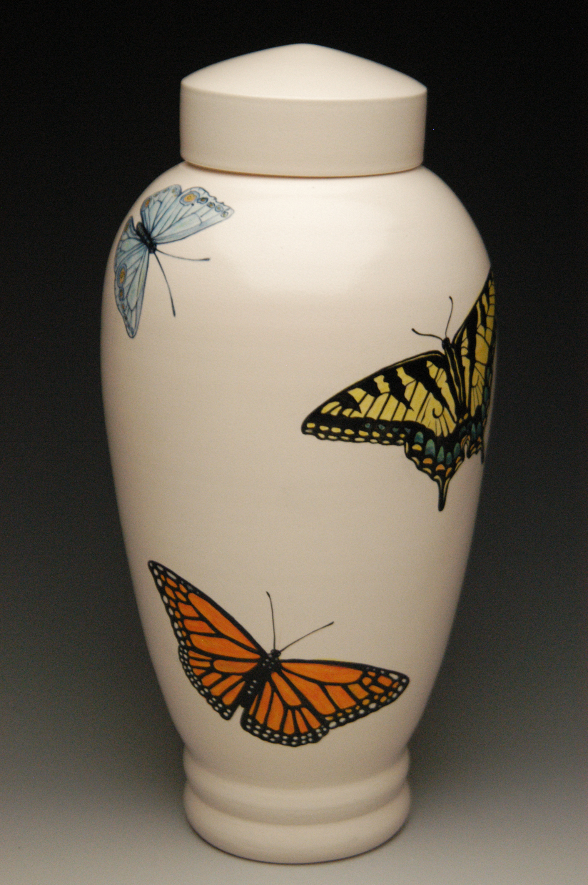 beautiful ceramic urn with hand painted butterflies