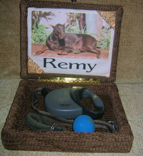 Remy's memorial box shown open with leash inside