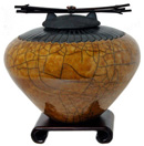 brown raku cremation vessel
