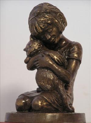 bronze sculpture of a little girl holding a cat