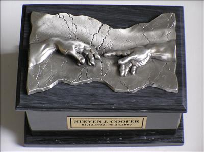 Marble cremation urn with Pewter hands of God