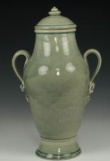 tall green ceramic urn