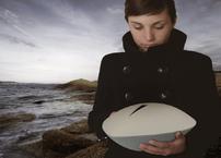 Girl holding sea urn