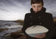 Girl holding sea urn